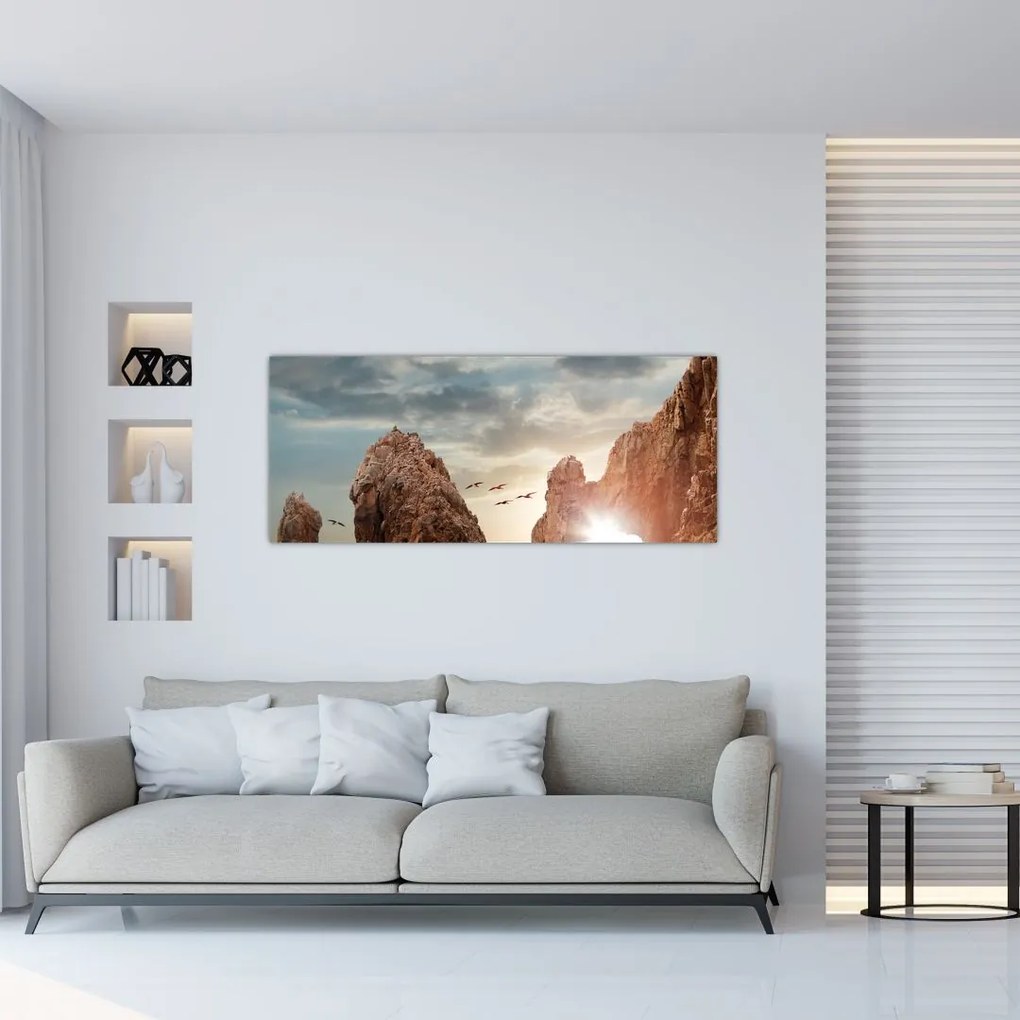 Tablou - Apus de soare peste stânci (120x50 cm)