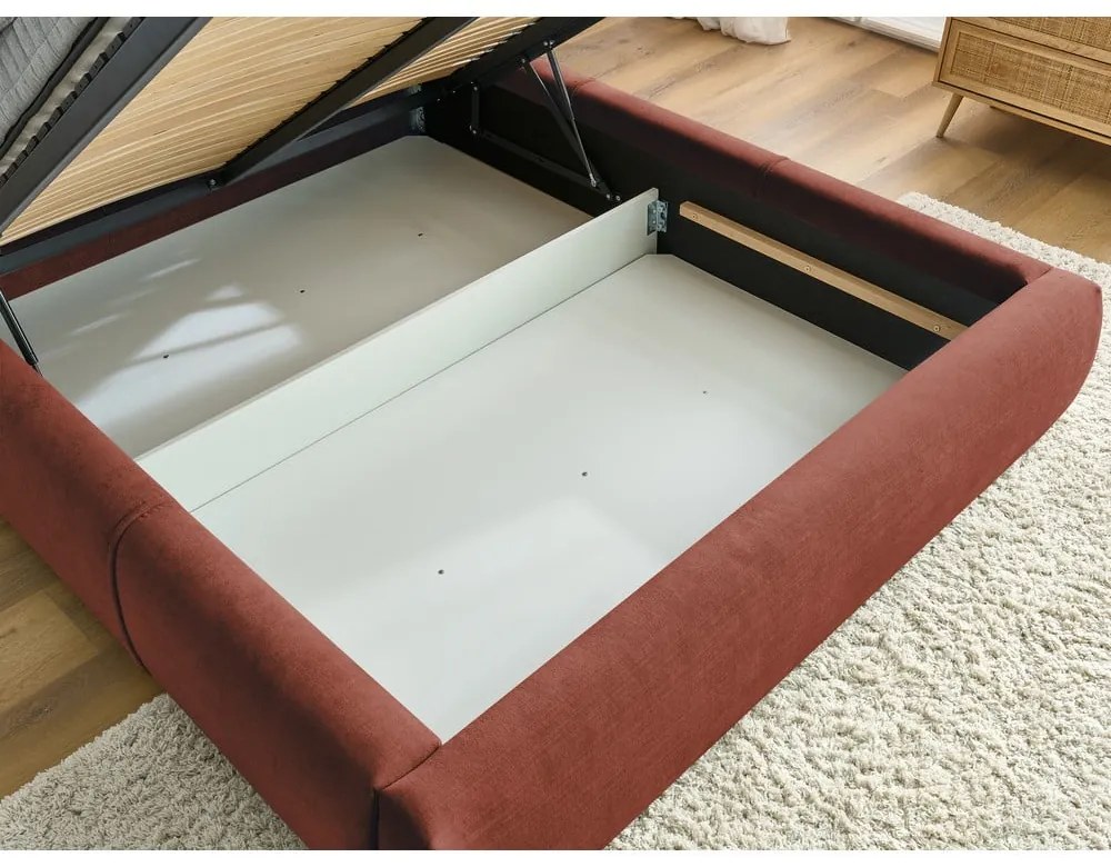 Pat matrimonial portocaliu tapițat cu spațiu de depozitare și somieră 180x200 cm Vernon – Bobochic Paris