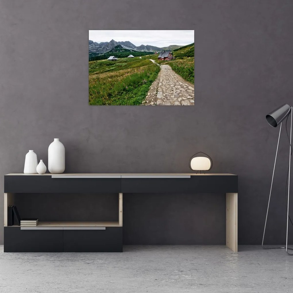 Tablou pe sticlă - Peisaj montan cu case (70x50 cm)