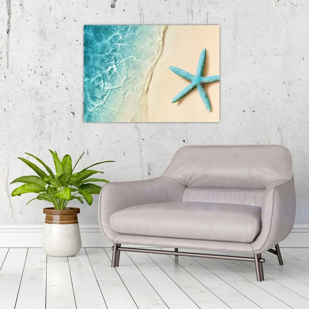Tablou pe sticlă - Stea de mare pe plajă (70x50 cm)