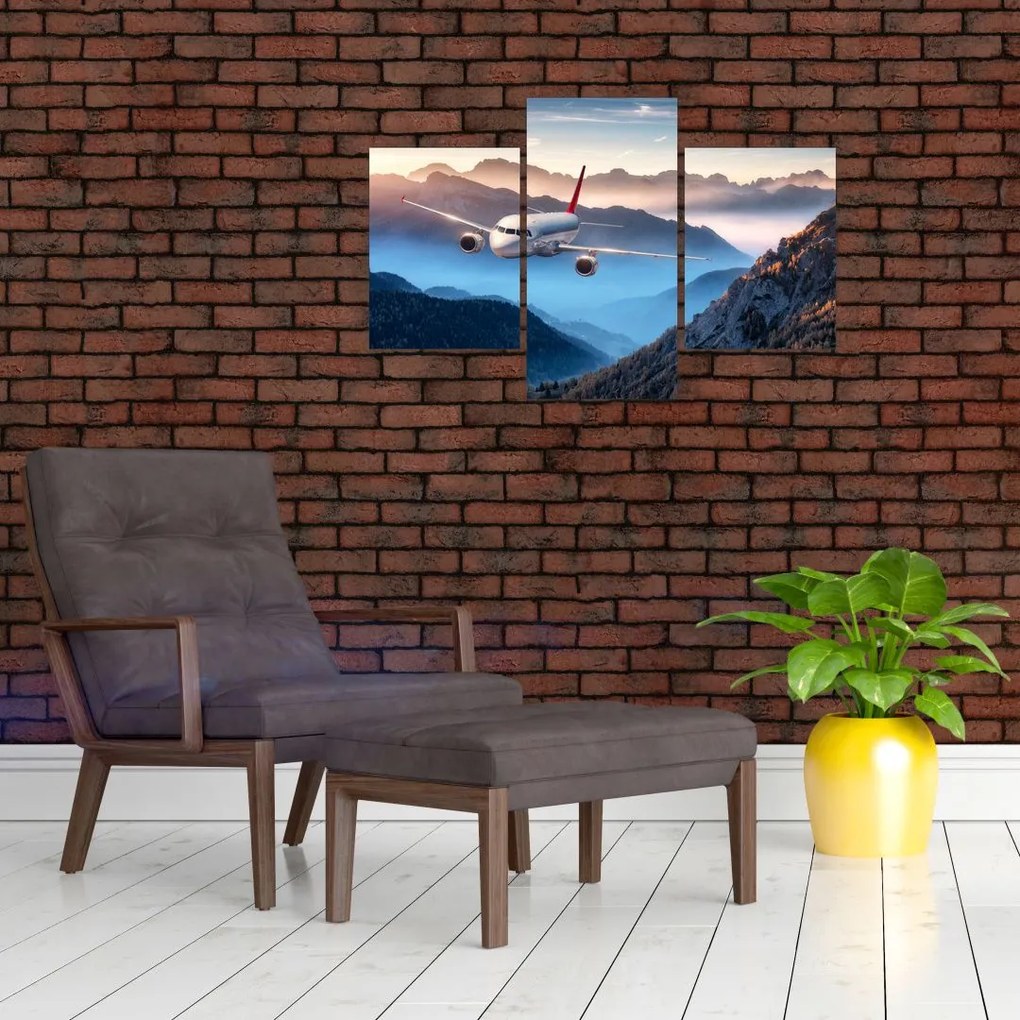 Tablou - Avion peste crestele montane (90x60 cm)