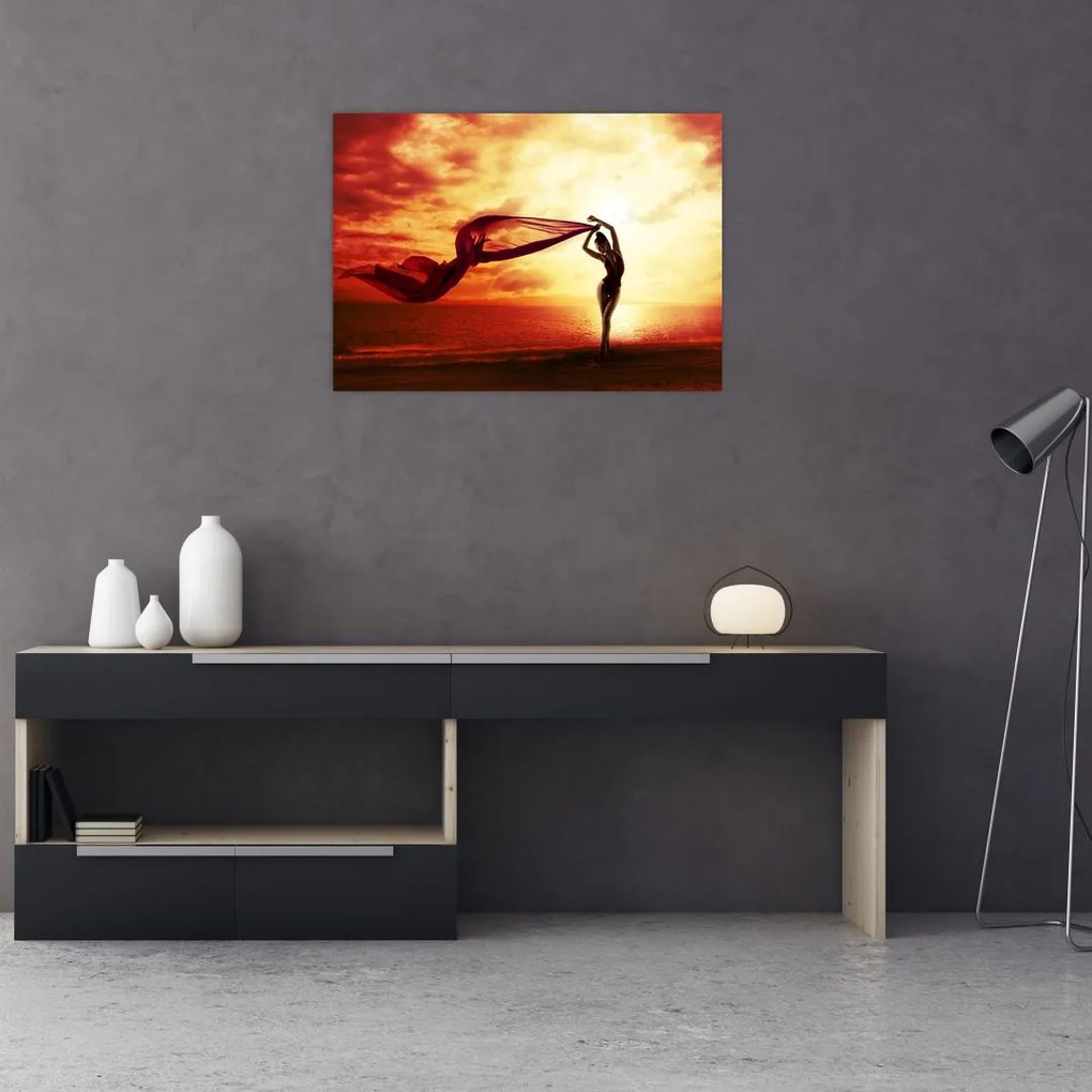 Tablou pe sticlă - Silueta femeii la apus de soare (70x50 cm)