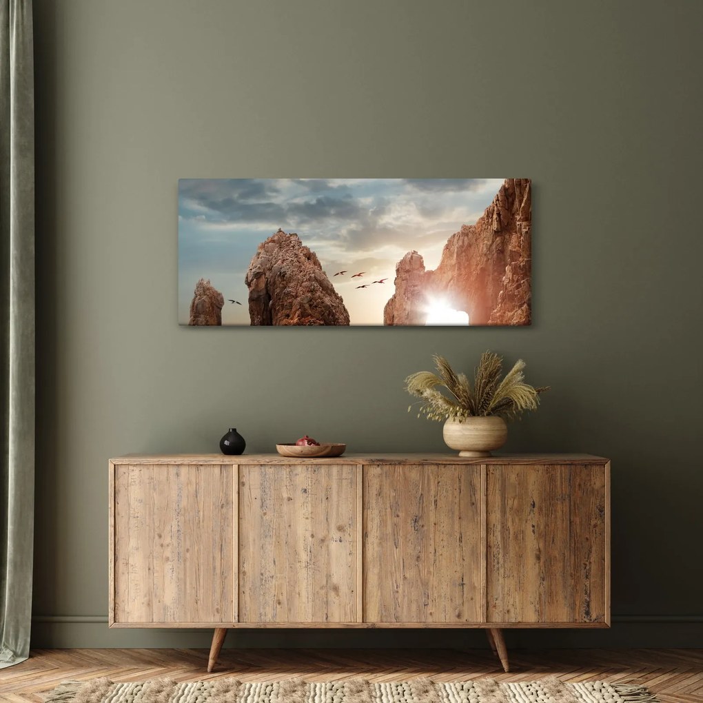 Tablou - Apus de soare peste stânci (120x50 cm)
