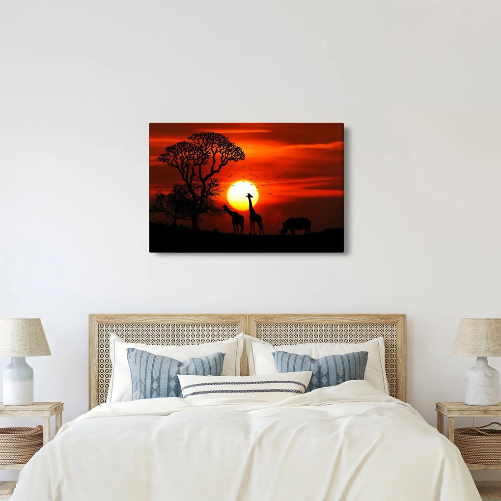 Tablou - Siluete animalelor la apus de soare (90x60 cm)