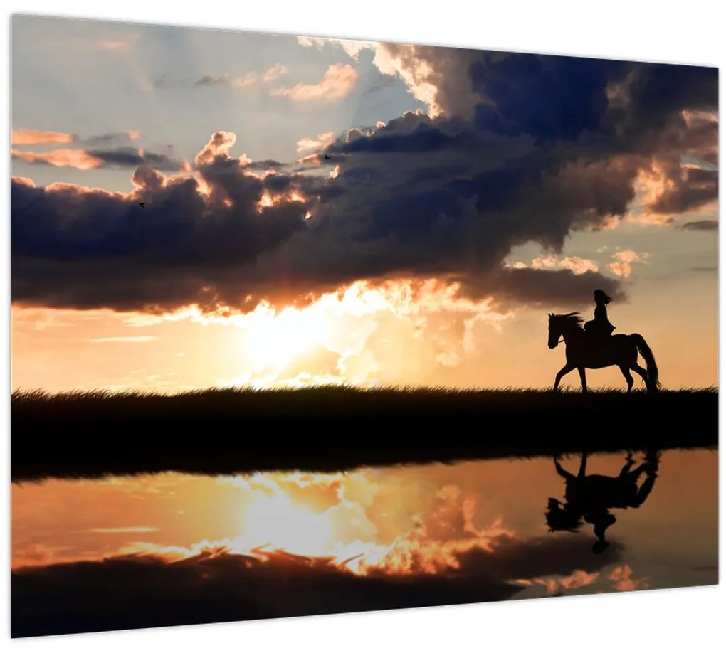 Tablou - Rider pe un cal la apus de soare (70x50 cm)