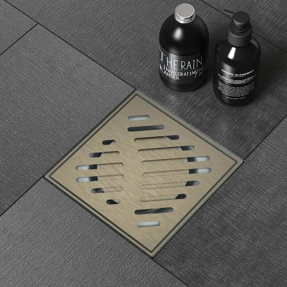 Set rigola pentru dus Inter Ceramic New Generation cu capac cu fante diagonale 10x10 cm finisaj bronz periat