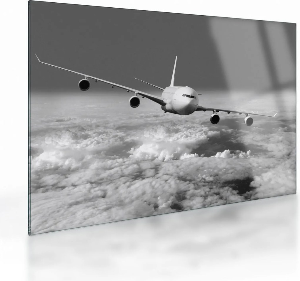 Tablou pe sticlă - Avion în nori, alb și negru (70x50 cm)