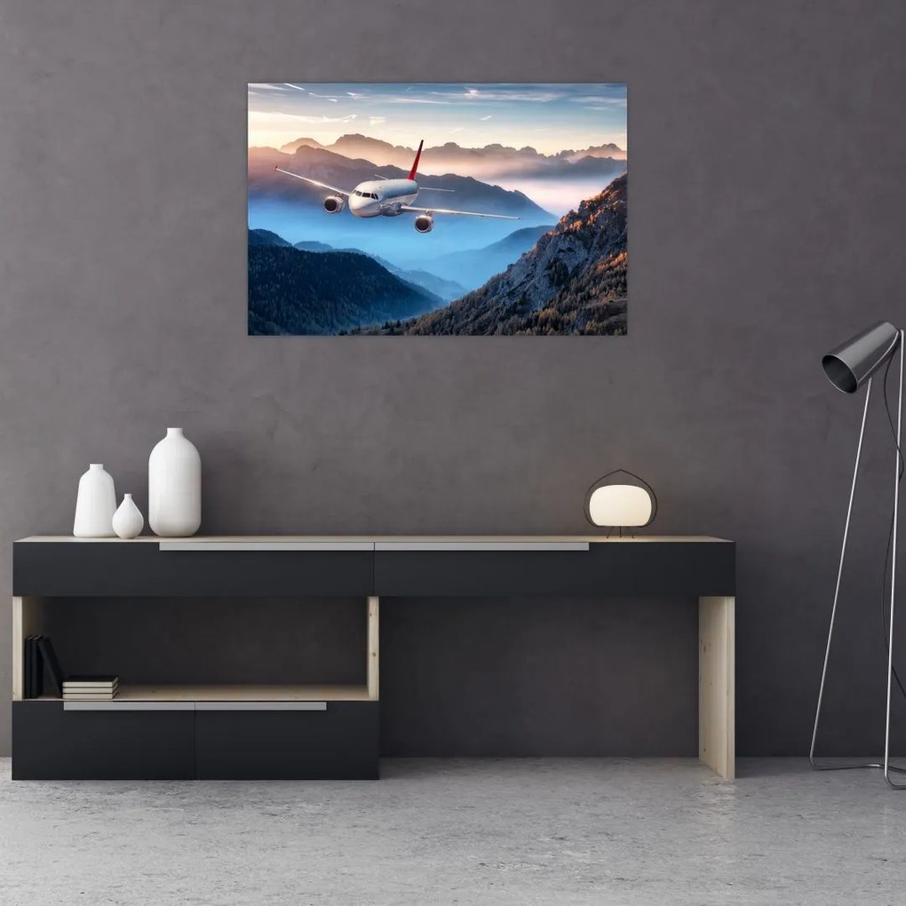 Tablou - Avion peste crestele montane (90x60 cm)