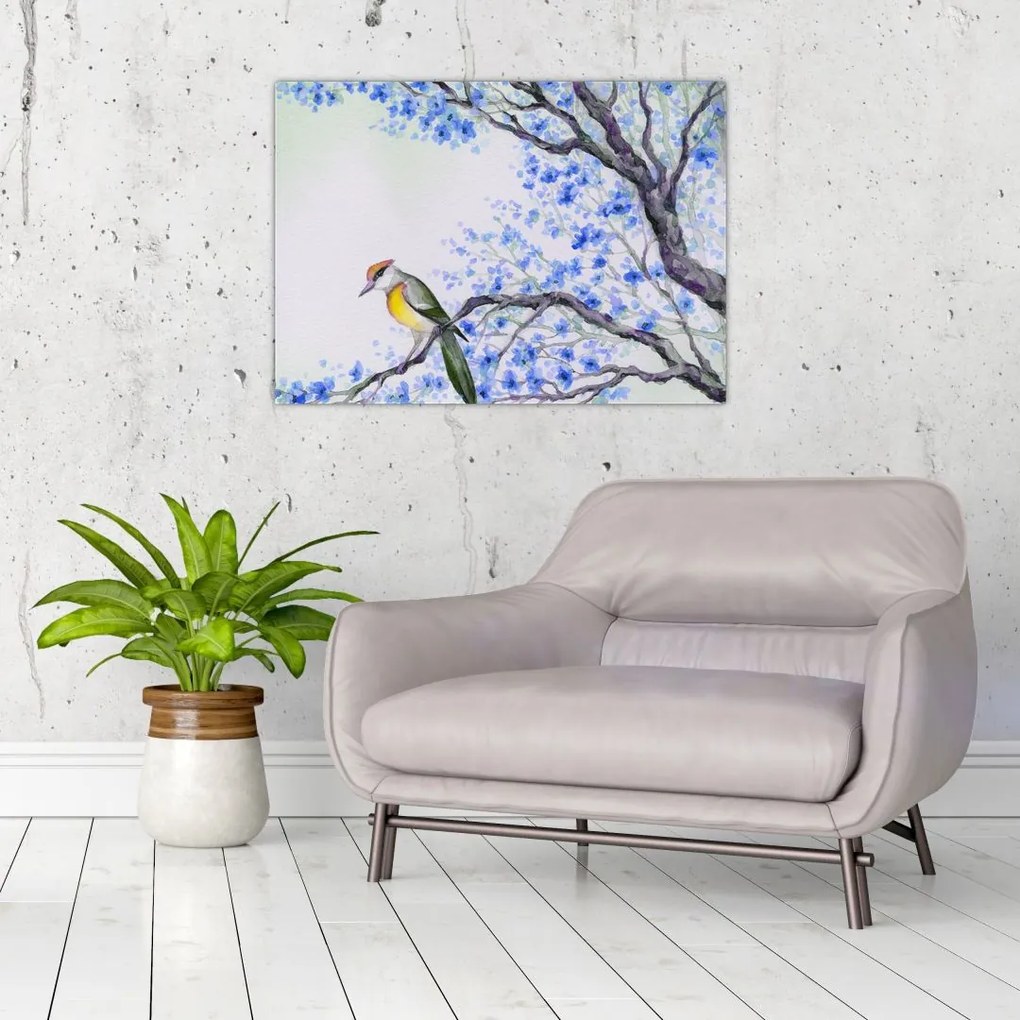 Tablou pe sticlă - Pasăre pe un copac cu flori albastre (70x50 cm)