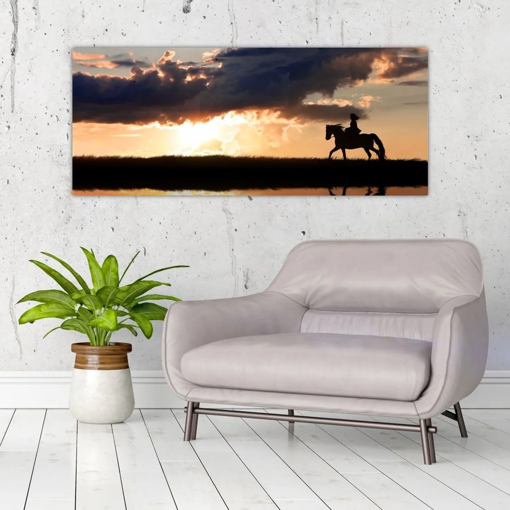Tablou - Rider pe un cal la apus de soare (120x50 cm)