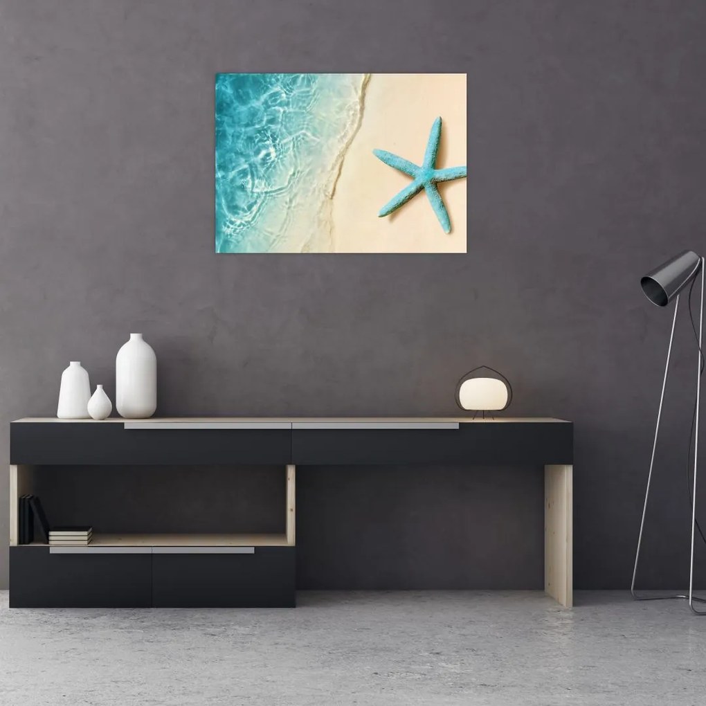Tablou pe sticlă - Stea de mare pe plajă (70x50 cm)