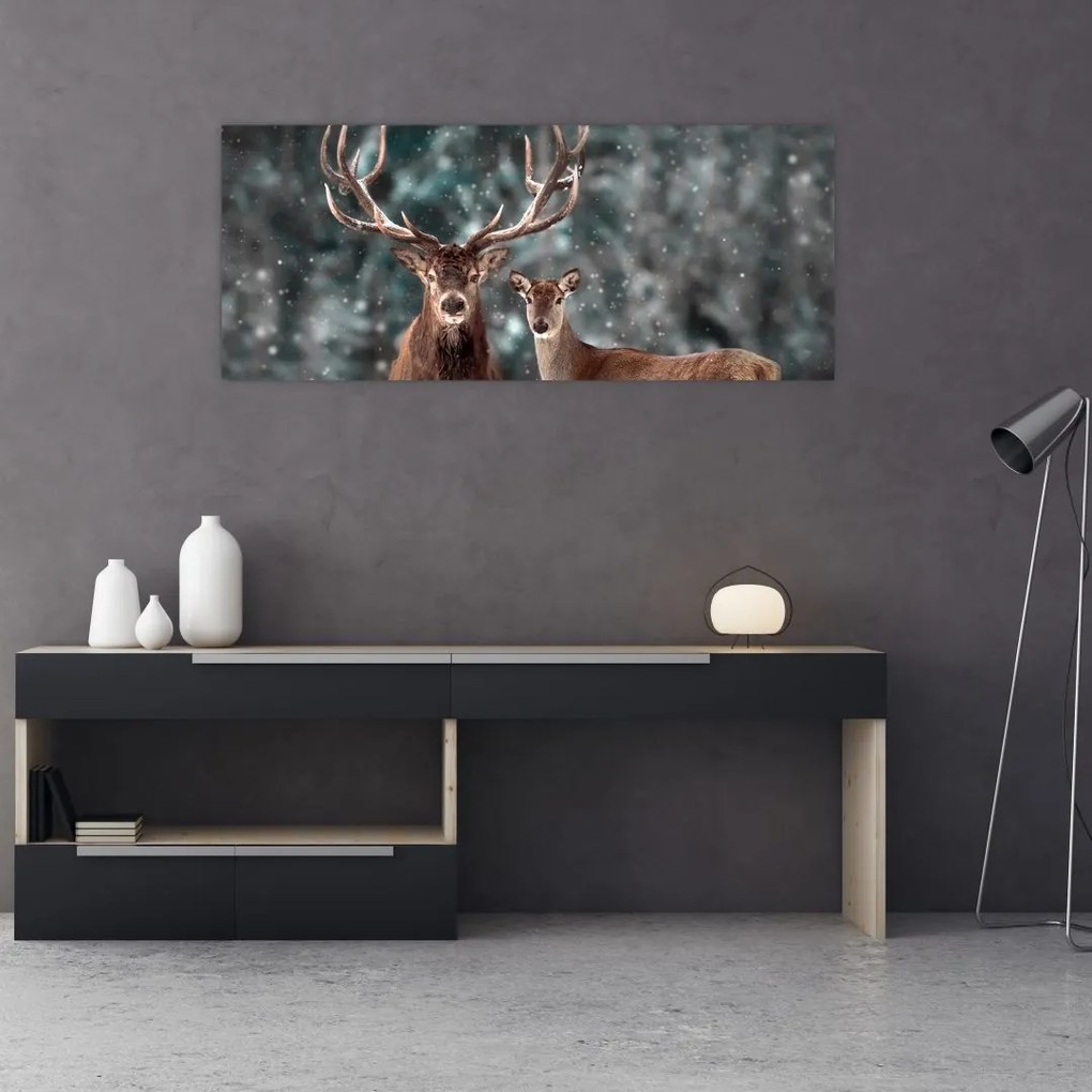 Tablou - Cerb și căprioare în pădurea înzăpezită (120x50 cm)