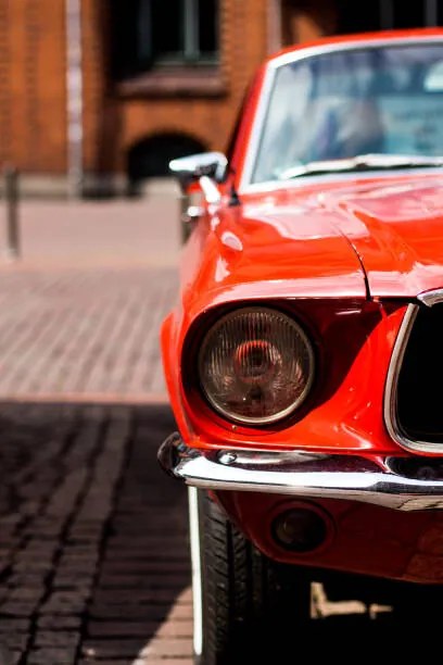 Ilustrație Closeup of a red classic mustang car, My pictures