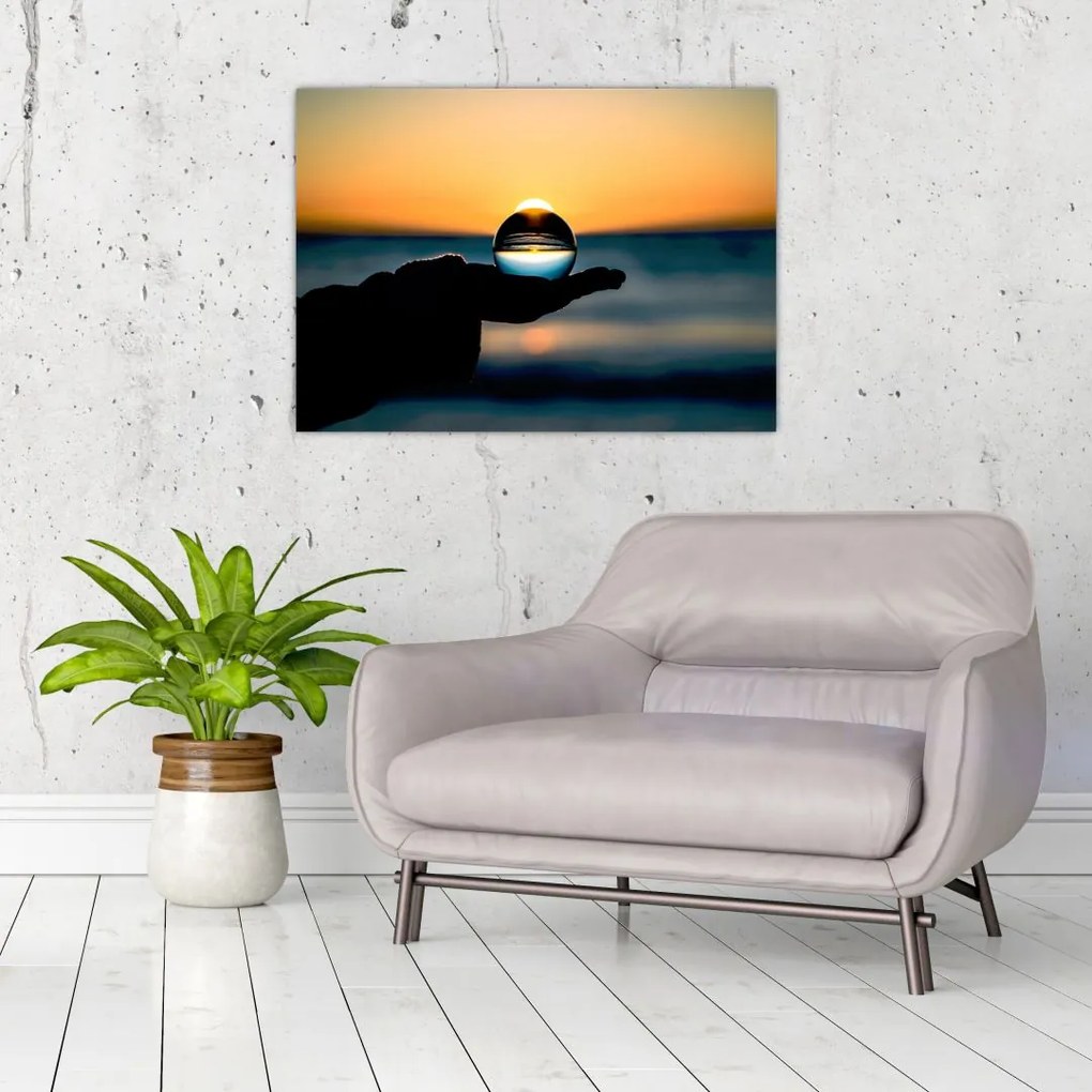 Tabloul cu bilă din sticlă în palmă (70x50 cm)