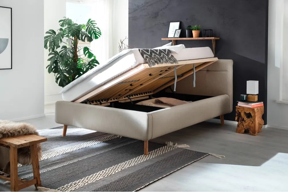 Pat matrimonial bej tapițat cu spațiu de depozitare cu somieră 140x200 cm Lotte – Meise Möbel