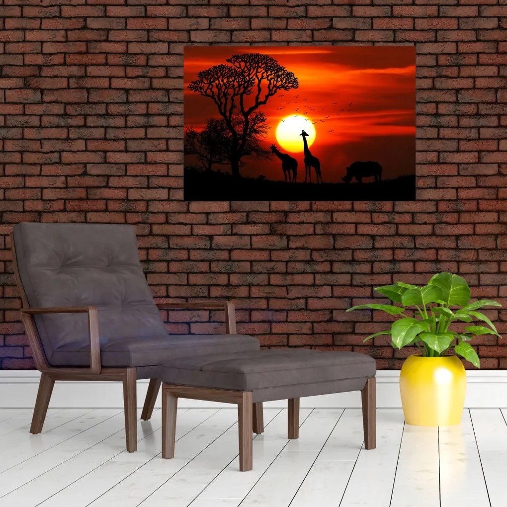 Tablou - Siluete animalelor la apus de soare (90x60 cm)