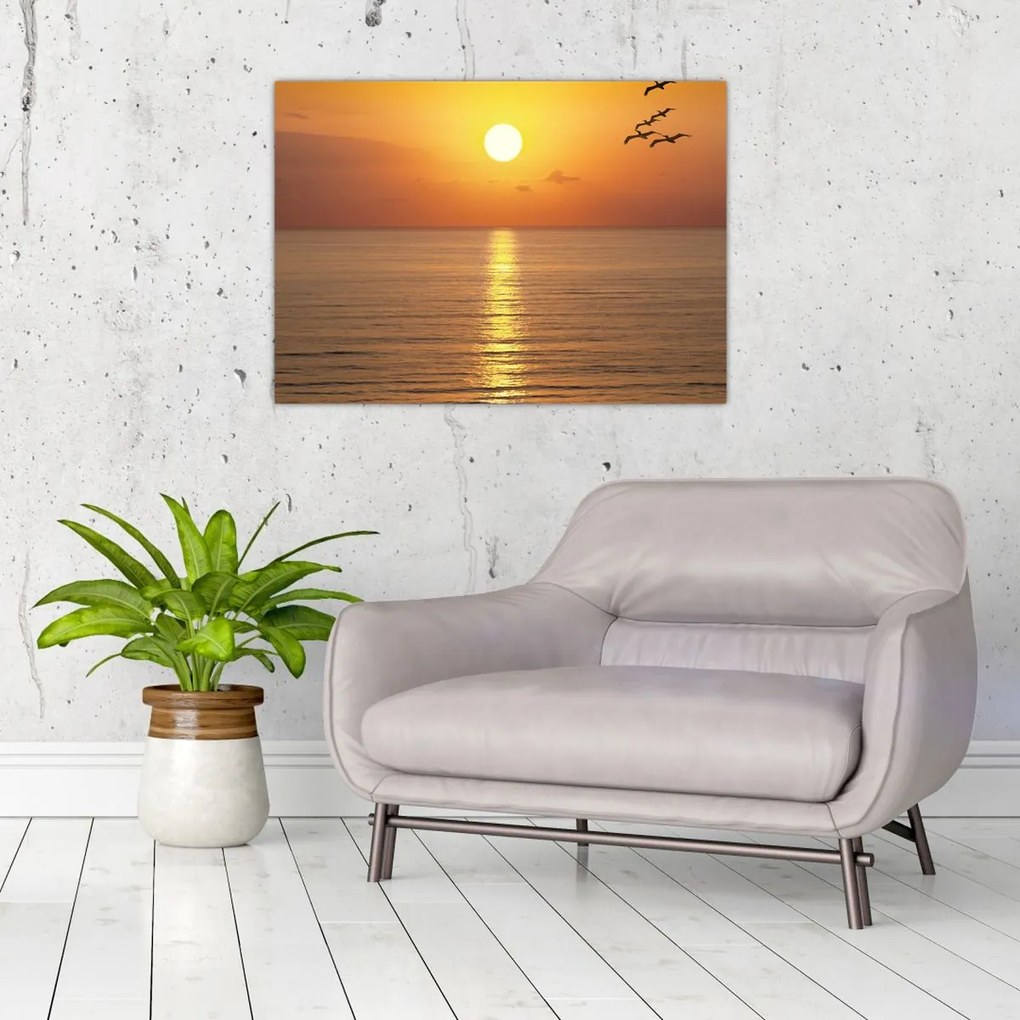 Tablou pe sticlă - Apus de soare peste ocean (70x50 cm)