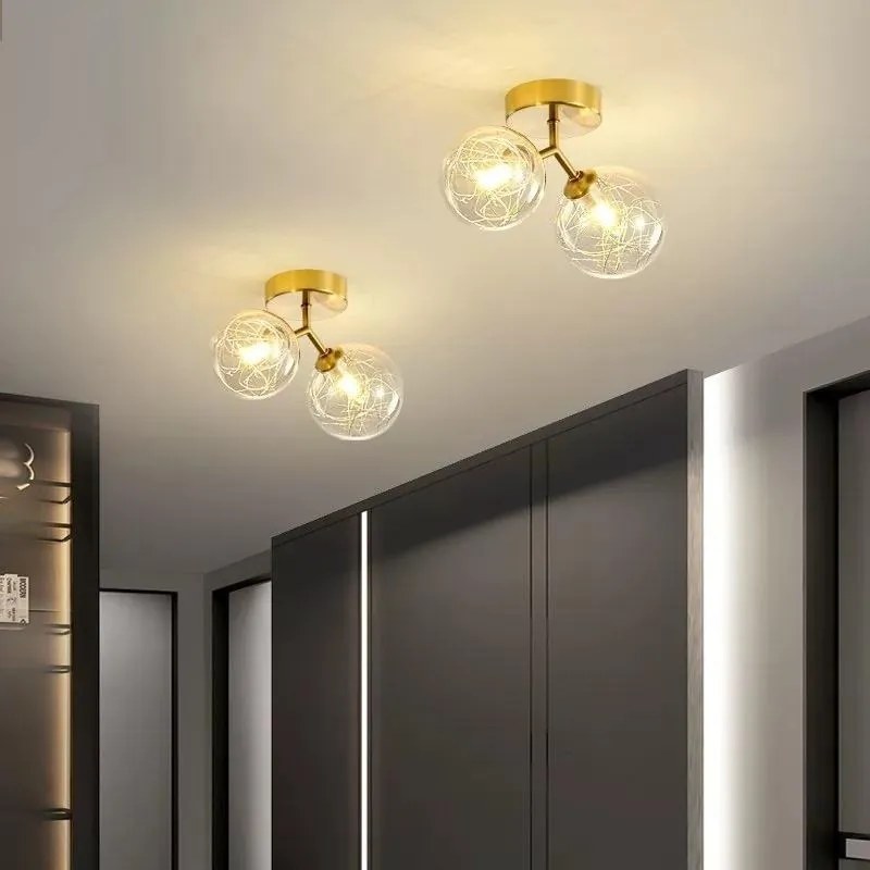 Lustra cu doua globuri transparente, auriu