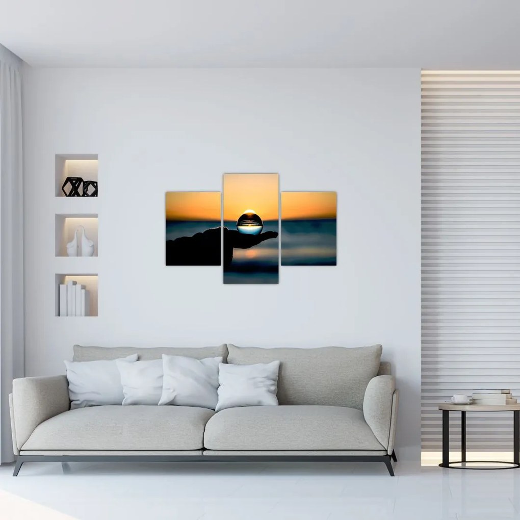 Tabloul cu bilă din sticlă în palmă (90x60 cm)
