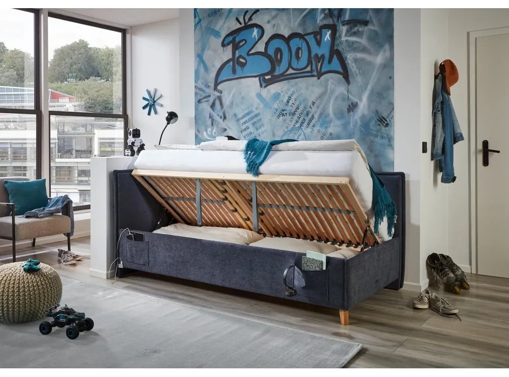 Pat pentru copii albastru închis pe colț tapițat cu spațiu de depozitare cu somieră 90x200 cm Fun – Meise Möbel