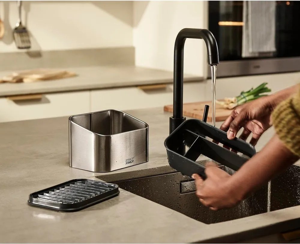 Suport pentru accesorii de spălat argintiu lucios din metal Surface – Joseph Joseph