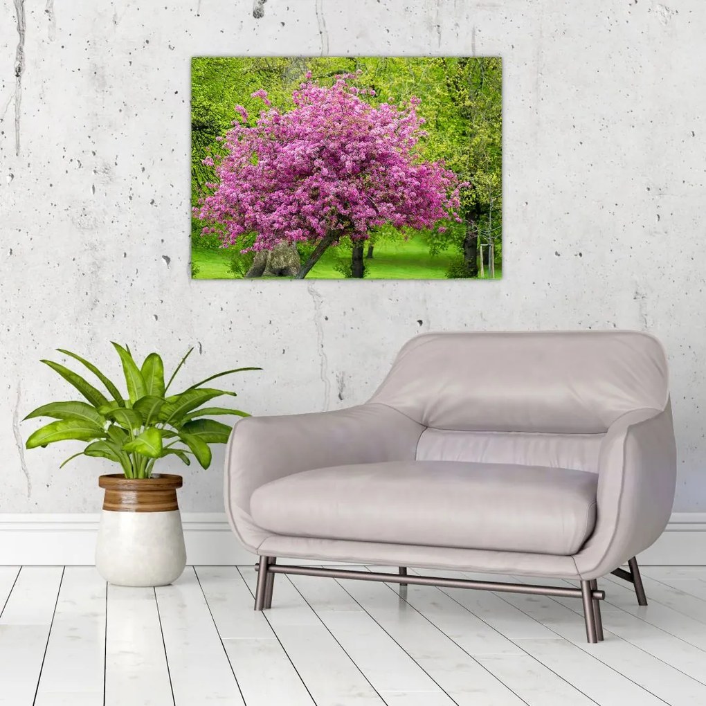 Tablou pe sticlă cu pom înflorit pe luncă (70x50 cm)