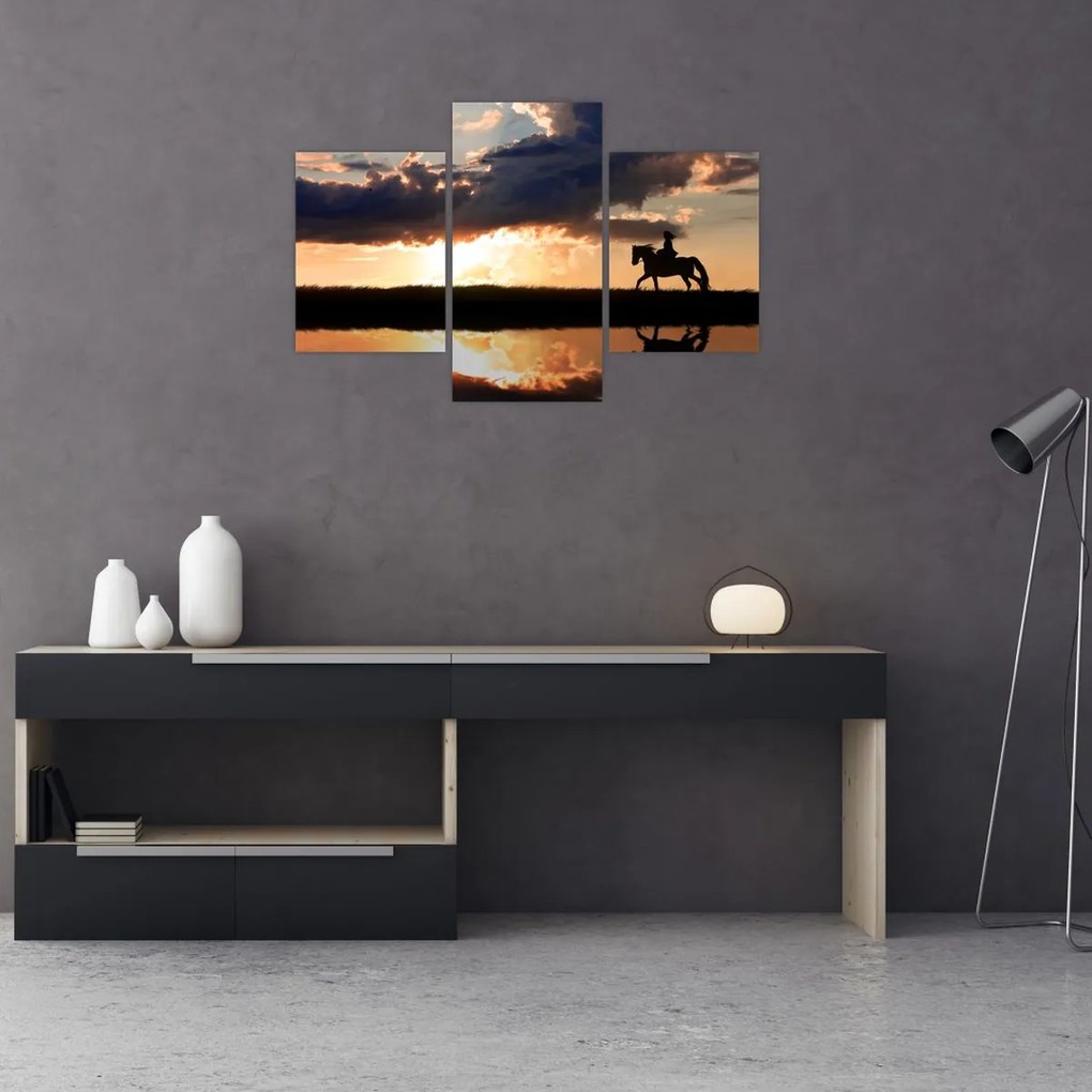 Tablou - Rider pe un cal la apus de soare (90x60 cm)