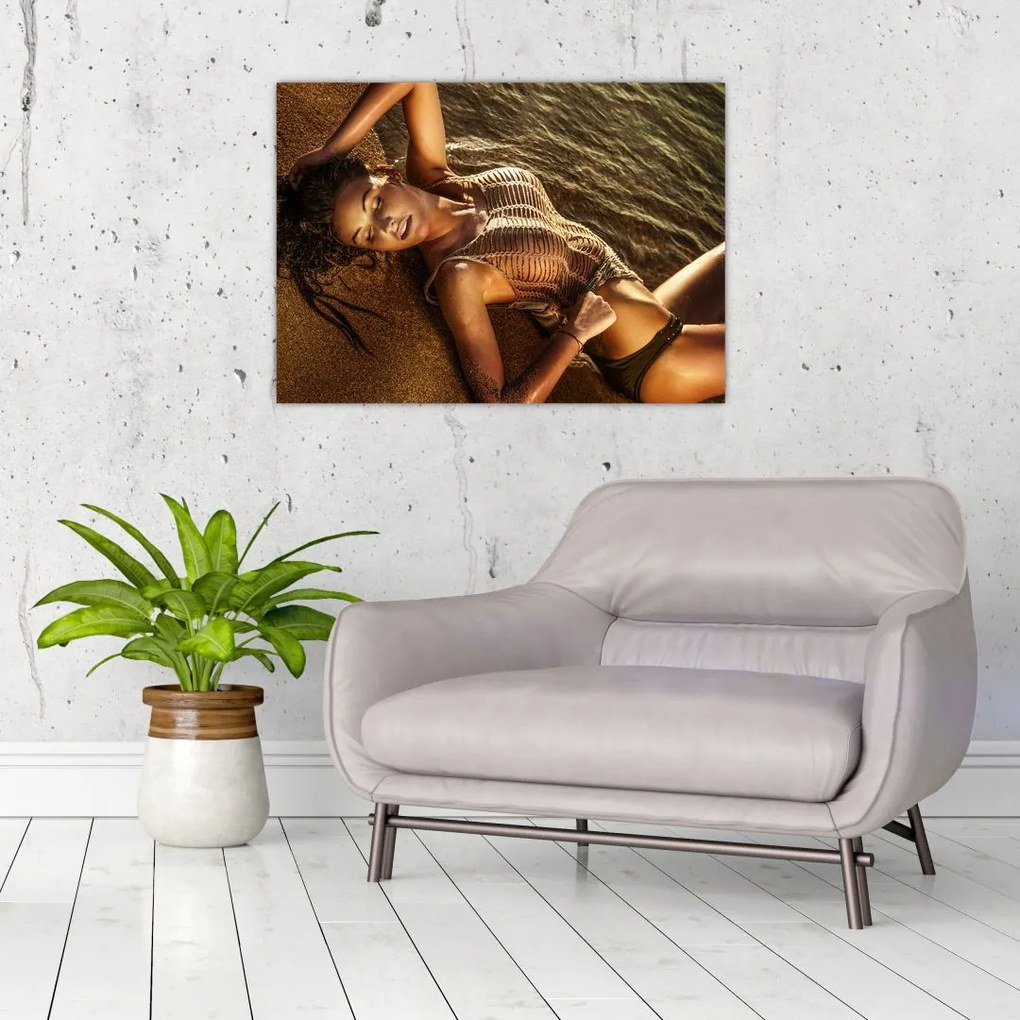 Tablou cu femeia întinsă pe plajă (70x50 cm)