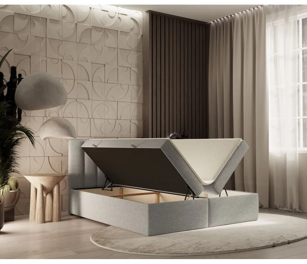 Pat boxspring gri deschis cu spațiu de depozitare 180x200 cm Novento – Maison de Rêve