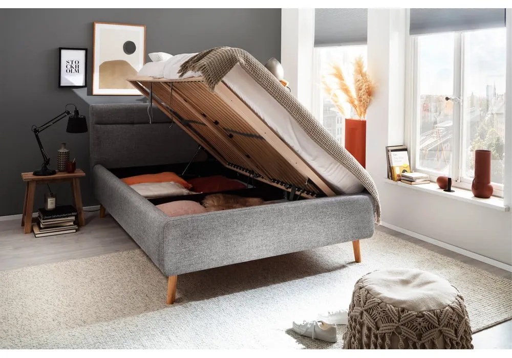 Pat matrimonial gri tapițat cu spațiu de depozitare cu somieră 140x200 cm Lotte – Meise Möbel