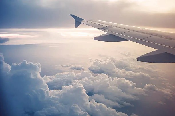 Ilustrație Image of airplane wing flying above the clouds, Moazzam Ali Brohi