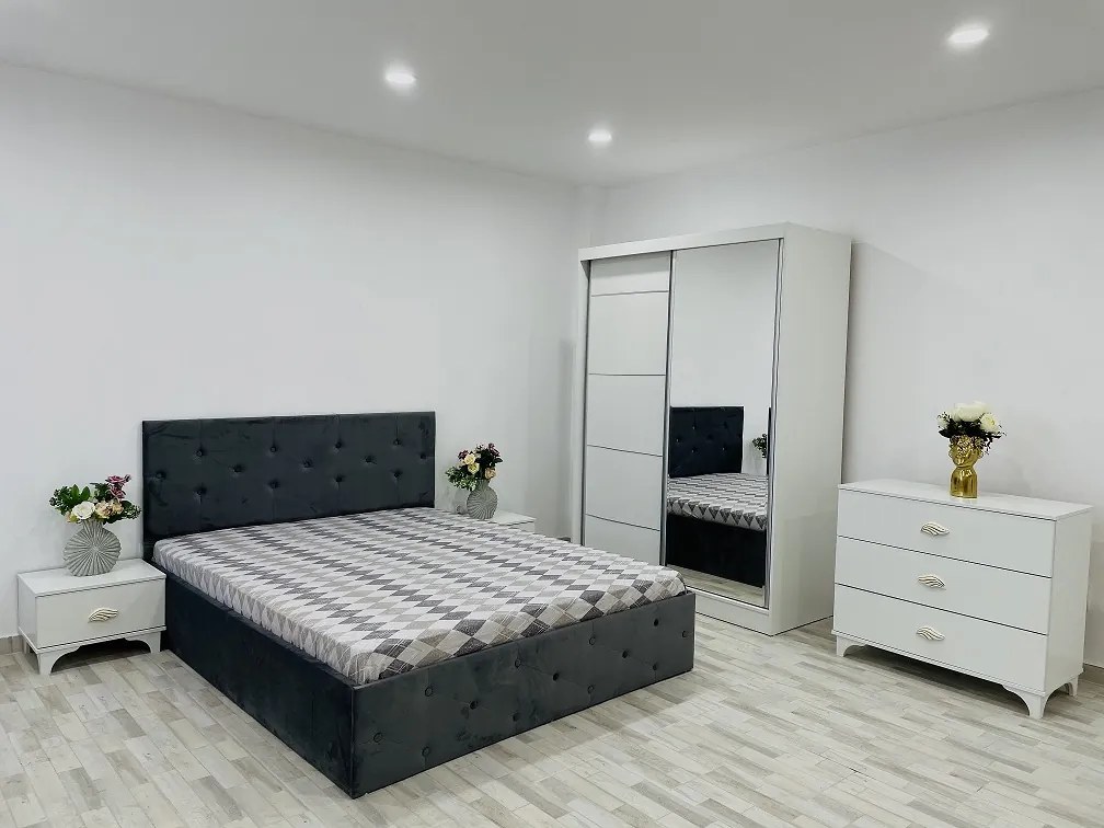 Dormitor Erika / Paris, culoare alb / gri, cu pat tapitat 160 x 200 cm, dulap cu oglinda 150 cm, comoda si 2 noptiere