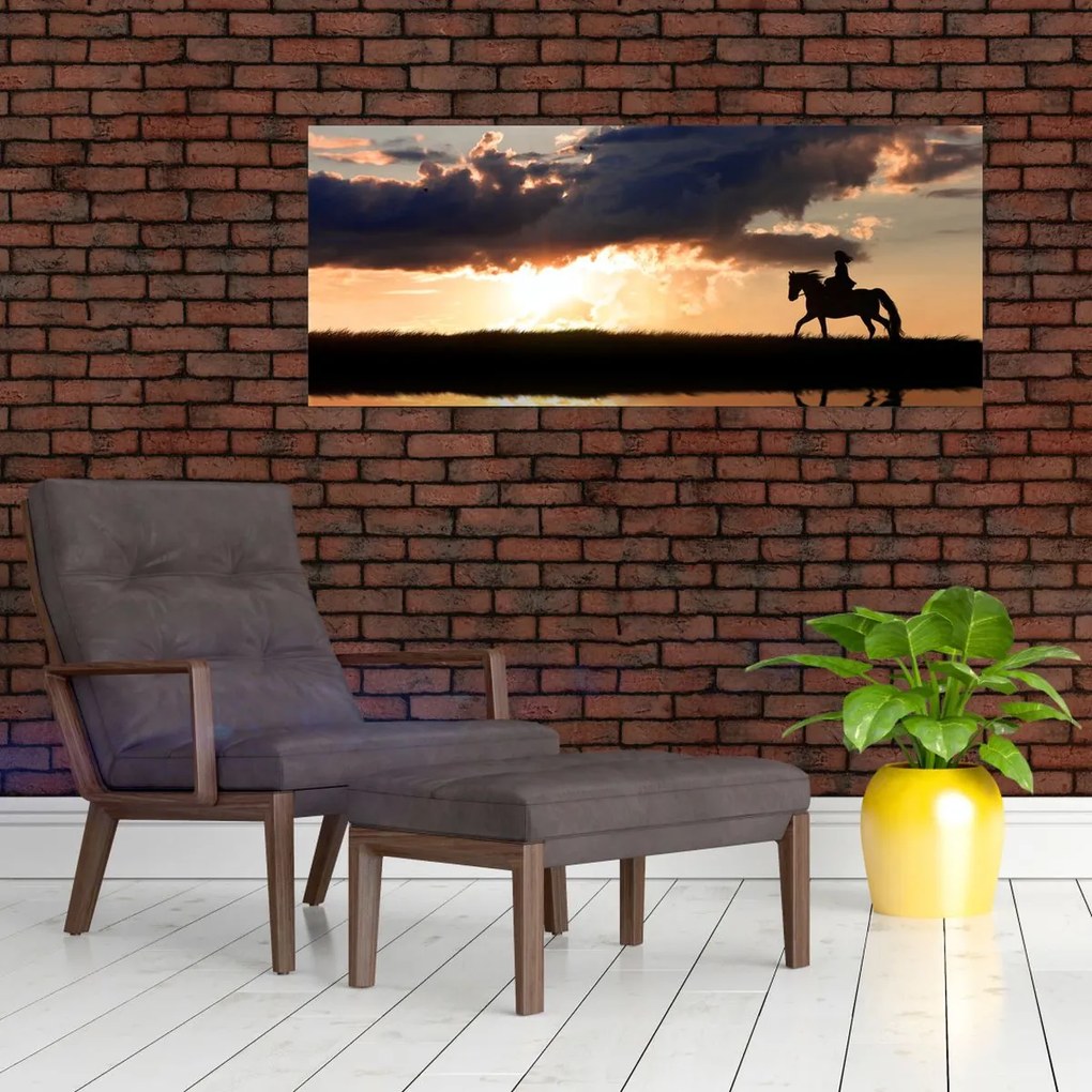 Tablou - Rider pe un cal la apus de soare (120x50 cm)