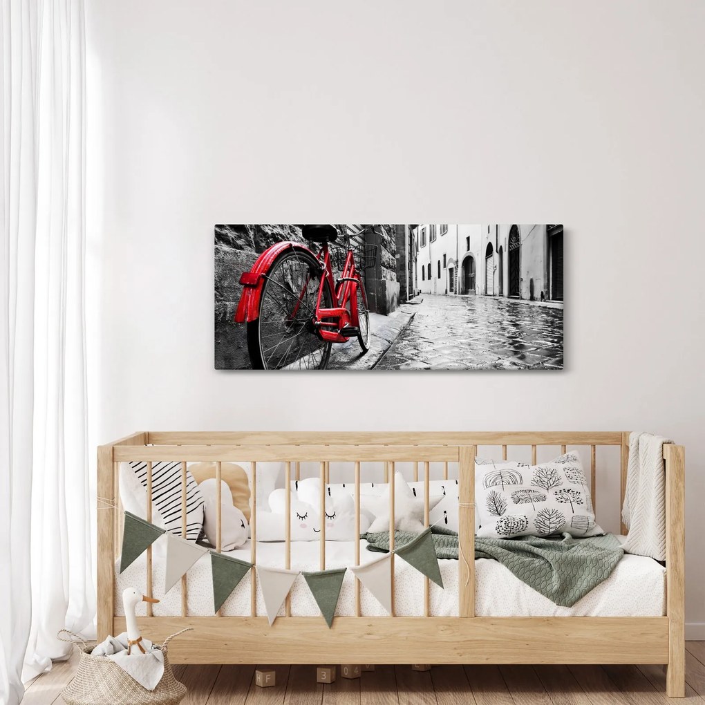 Tablou - Bicicleta roșie pe o stradă pavată (120x50 cm)