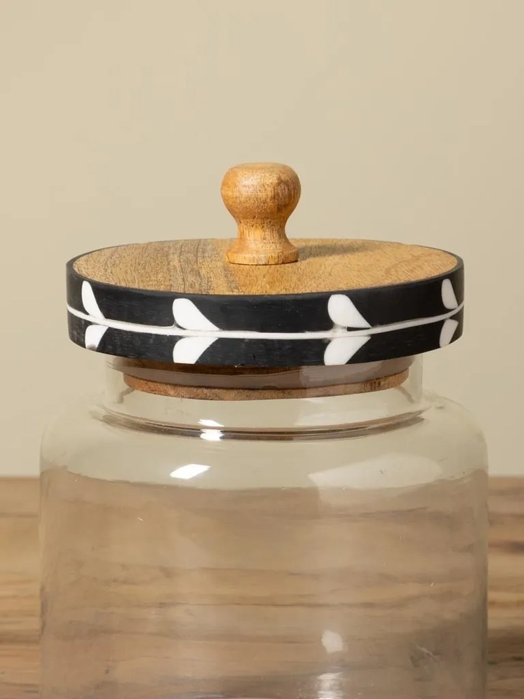Borcan din sticlă cu capac din lemn de mango negru, model cu frunze stilizate albe, 21 × 15 cm, „Sylve"