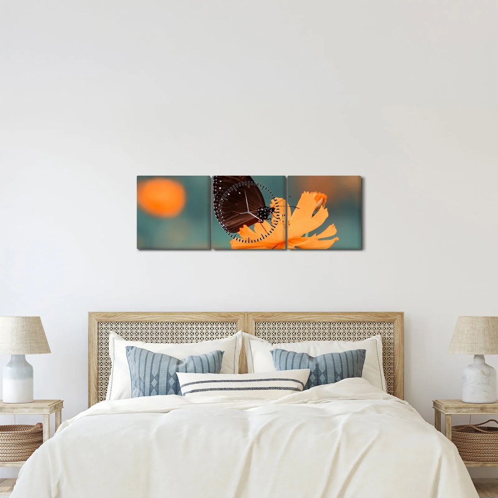 Tablou - fluture pe o floare portocalie (cu ceas) (90x30 cm)