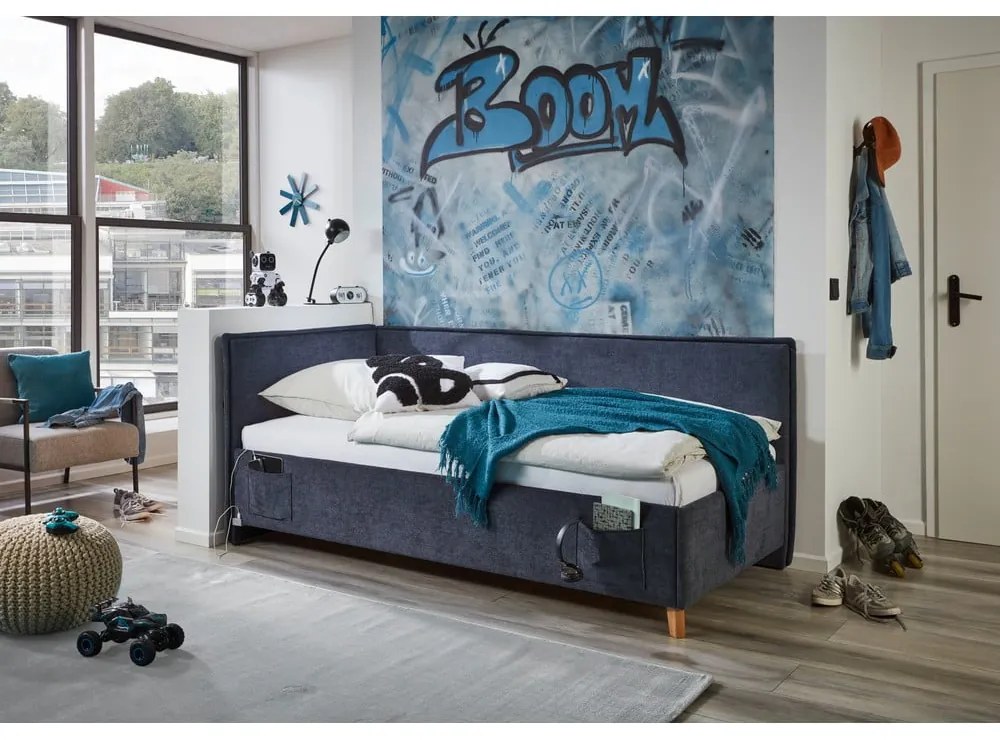 Pat pentru copii albastru închis pe colț tapițat cu spațiu de depozitare cu somieră 140x200 cm Fun – Meise Möbel