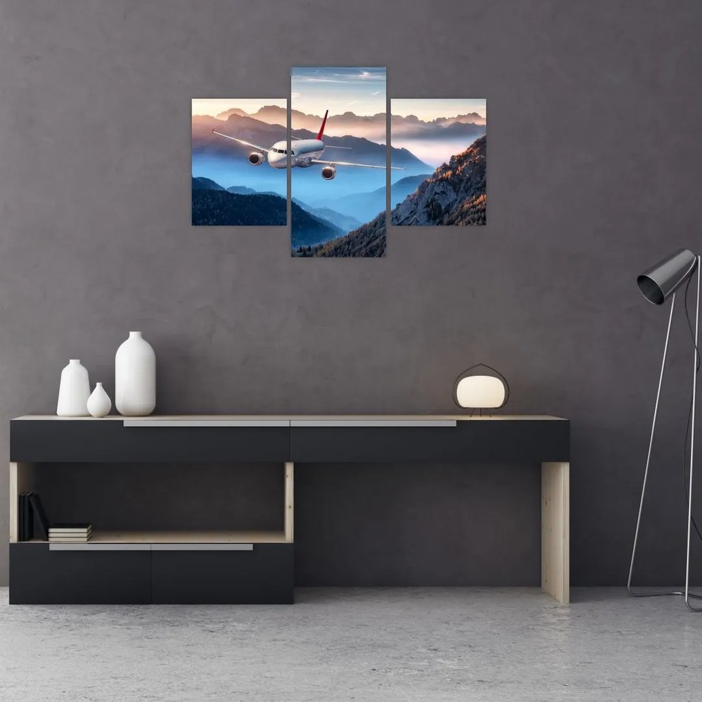 Tablou - Avion peste crestele montane (90x60 cm)