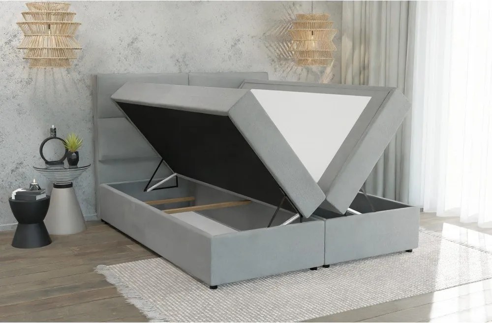 Pat boxspring gri deschis cu spațiu de depozitare 180x200 cm Rico – Ropez
