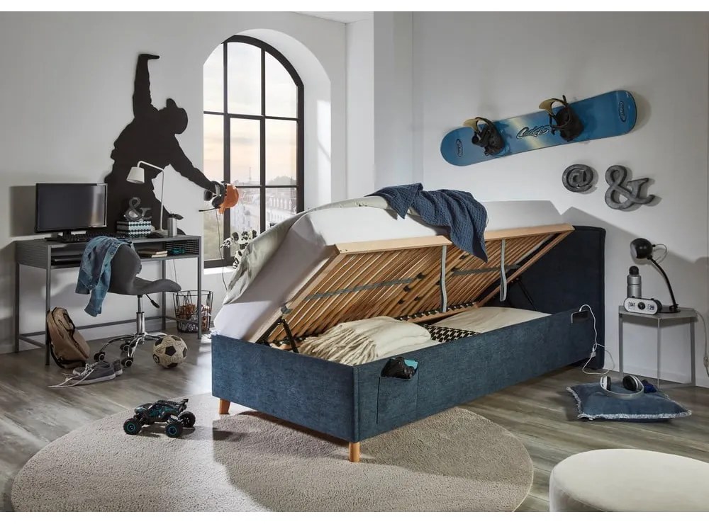 Pat pentru copii albastru închis tapițat cu spațiu de depozitare cu somieră 90x200 cm Fun – Meise Möbel