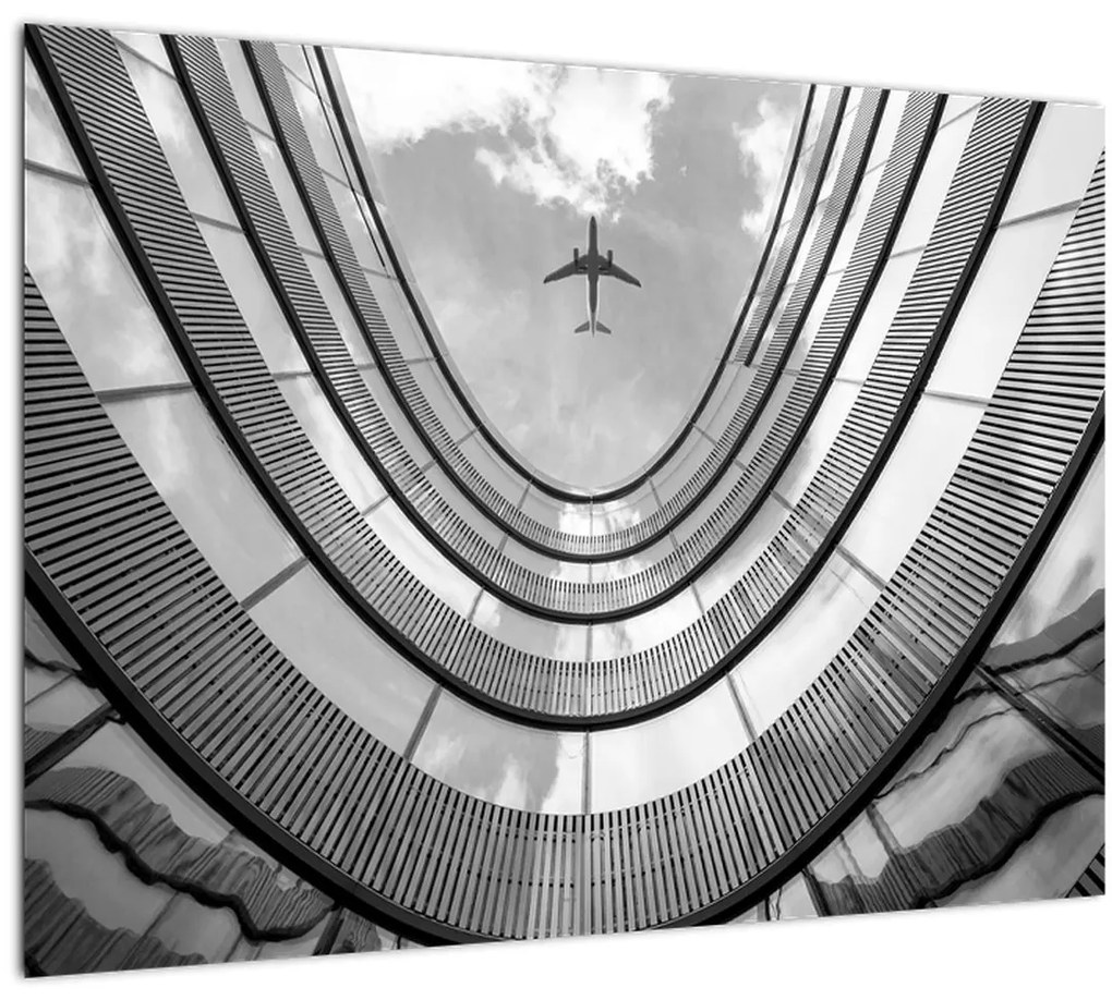 Tablou pe sticlă - Avionul deasupra clădirii (70x50 cm)