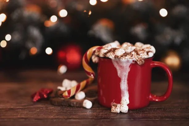 Fotografie wooden desk space red mug and xmas tree, Kseniya Ovchinnikova