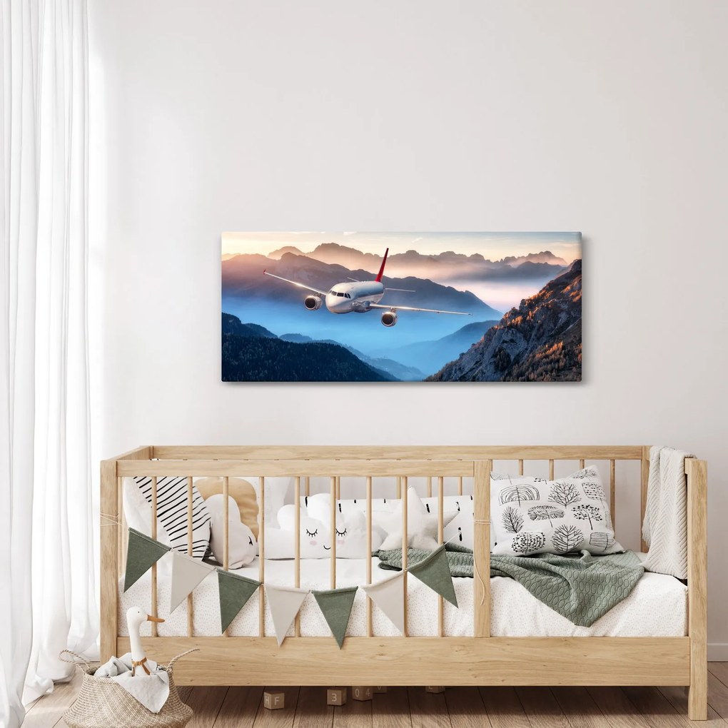 Tablou - Avion peste crestele montane (120x50 cm)