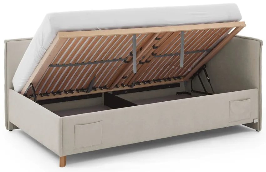 Pat pentru copii bej pe colț tapițat cu spațiu de depozitare cu somieră 140x200 cm Fun – Meise Möbel