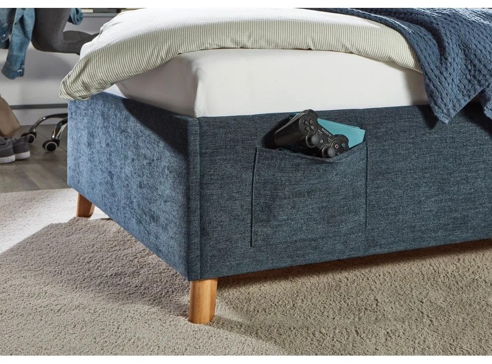 Pat pentru copii albastru închis tapițat cu spațiu de depozitare cu somieră 120x200 cm Fun – Meise Möbel