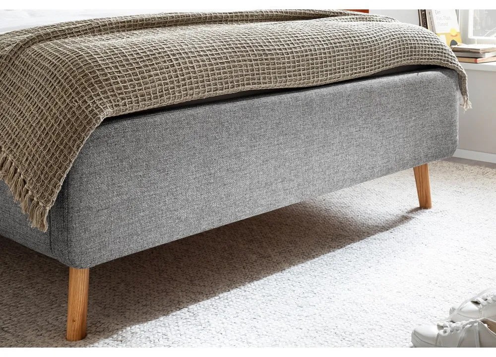 Pat matrimonial gri tapițat cu spațiu de depozitare cu somieră 140x200 cm Lotte – Meise Möbel