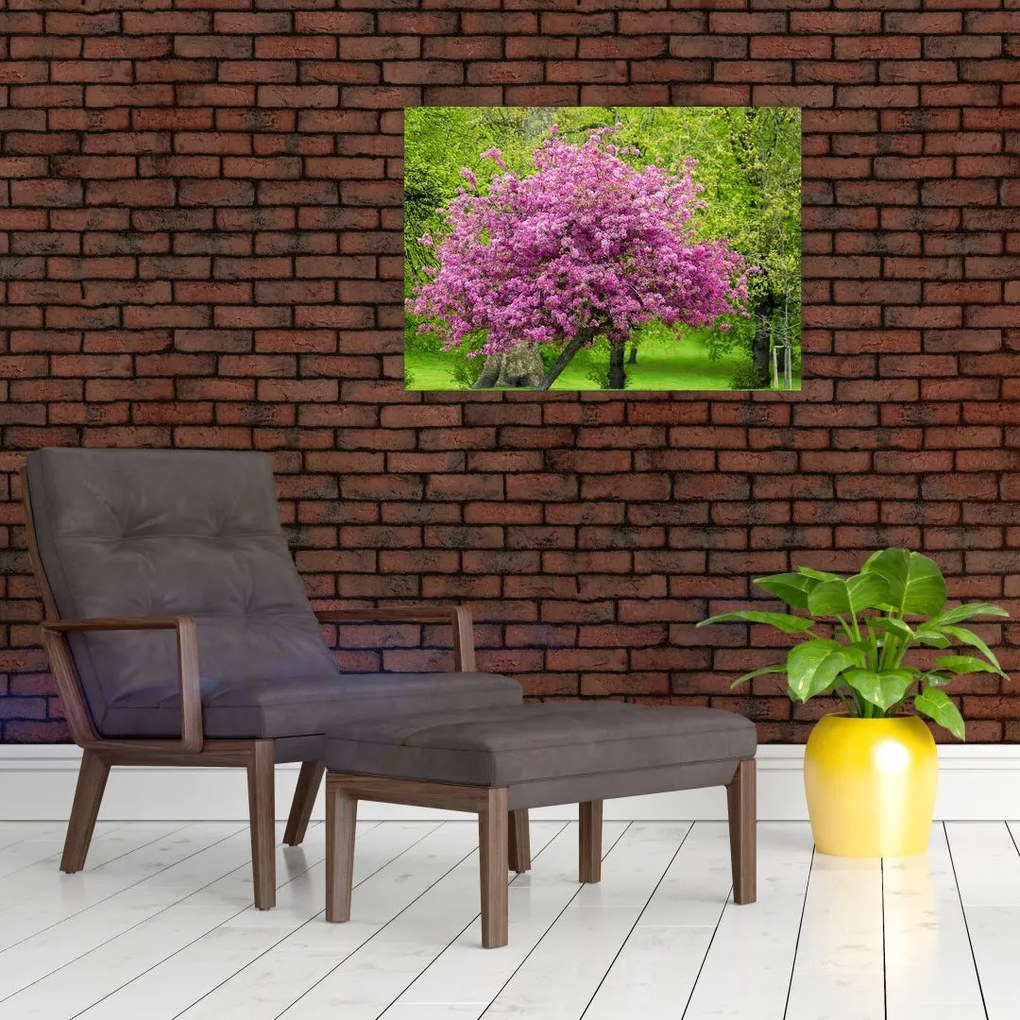Tablou pe sticlă cu pom înflorit pe luncă (70x50 cm)