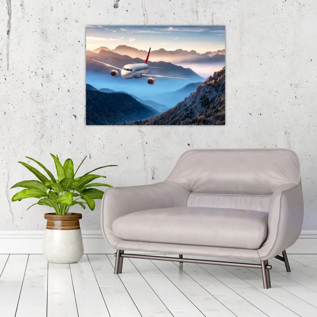 Tablou pe sticlă - Avion peste crestele montane (70x50 cm)