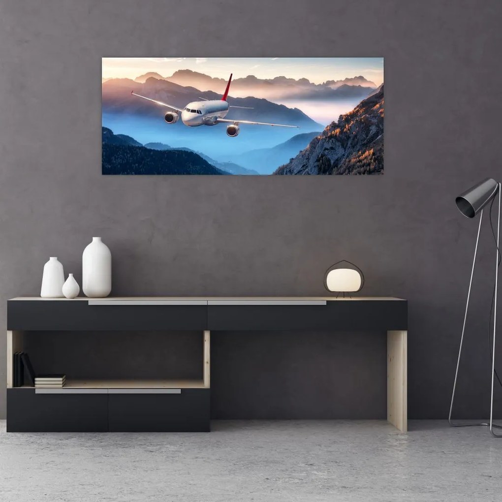 Tablou - Avion peste crestele montane (120x50 cm)