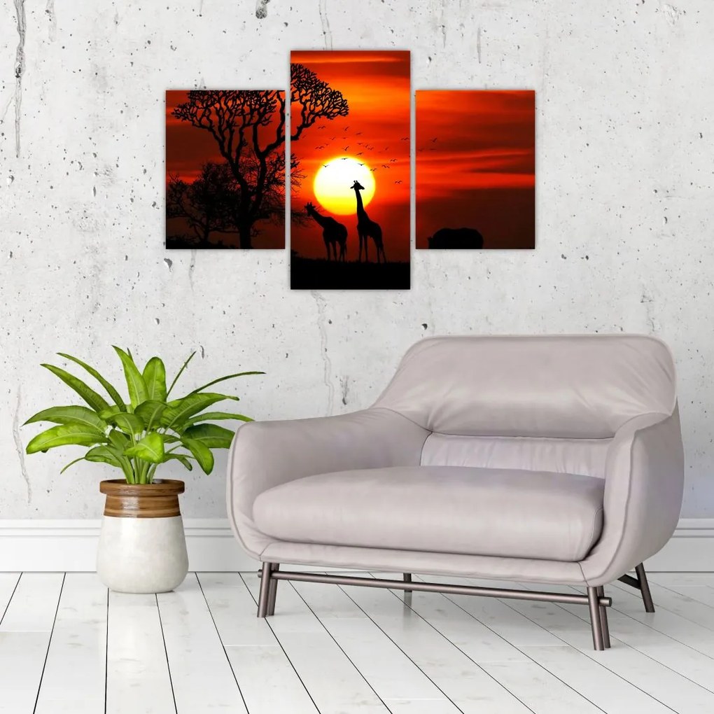 Tablou - Siluete animalelor la apus de soare (90x60 cm)